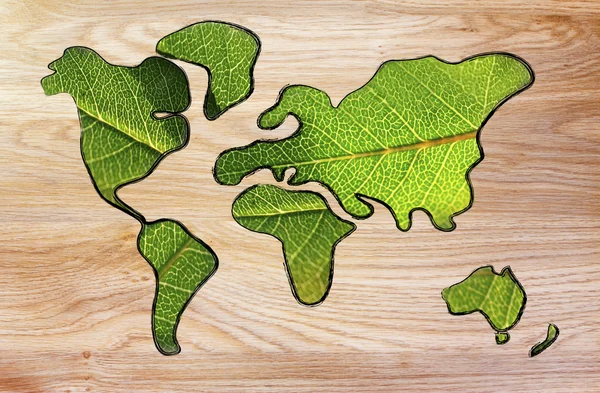 Green economy, world map covered by green leaves — Stock Photo, Image