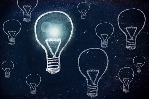 Winning idea, chalk design with lightbulbs — Stock Photo, Image