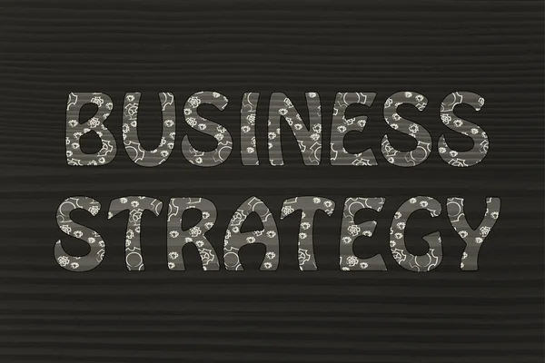 Estratégia de negócios escrita com padrão de engrenagens brilhantes — Fotografia de Stock