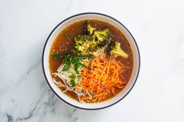 vegan ramen noodles soup with carrots and broccoli, healthy plant-based food recipes