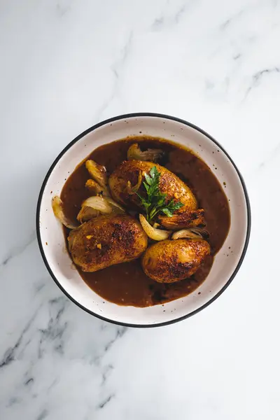 stock image vegan roasted potatoes and onion with gravy, healthy plant-based food recipes