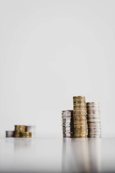 Stacks Different Coins Divided Small Big Group White Background Concept — Stock Photo, Image