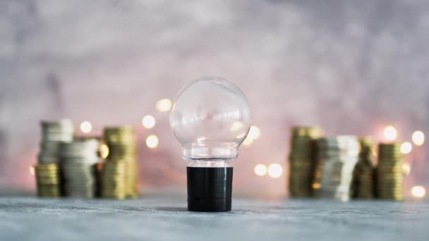 Idea Light Bulb Stacks Different Golden Silver Coins Representing Big — Stock Video