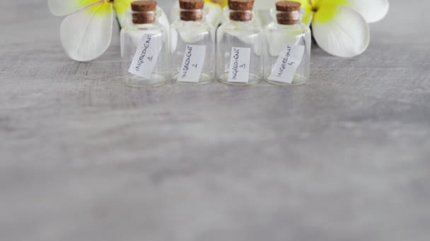 Small Bottles Ingredients Flowers Background Concept Natural Beauty Organic Ingredients — Wideo stockowe