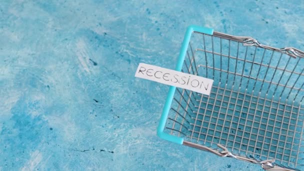 Economy Pandemic Recession Inflation Texts Sides Empty Shopping Basket Blue — Stock Video