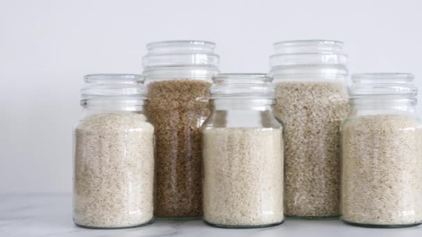 Glass Jar Rice Different Varieties Including Jasmine Basmati Arborio Sushi — Vídeo de stock