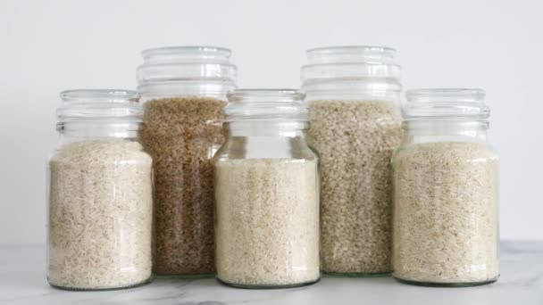 Glass Jar Rice Different Varieties Including Jasmine Basmati Arborio Sushi — Stock Video