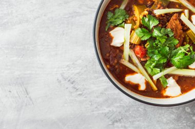 plant-based Mexican vegetable stew with beans mock meat celeri and coriander in spicy sauce, healthy vegan food recipes