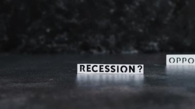 recession or opportunity texts over dark background with focus switching between the two