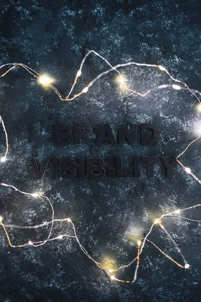 Brand Visibility Text Barely Visible Dark Background Fairy Lights Concept — Foto de Stock