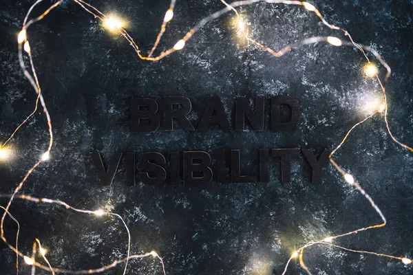 Brand Visibility Text Barely Visible Dark Background Fairy Lights Concept — Foto de Stock
