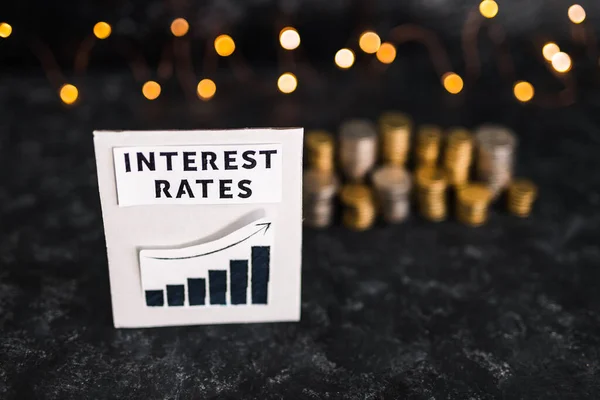 Interest Rates Text Graph Showing Stats Going Front Stacks Coins – stockfoto