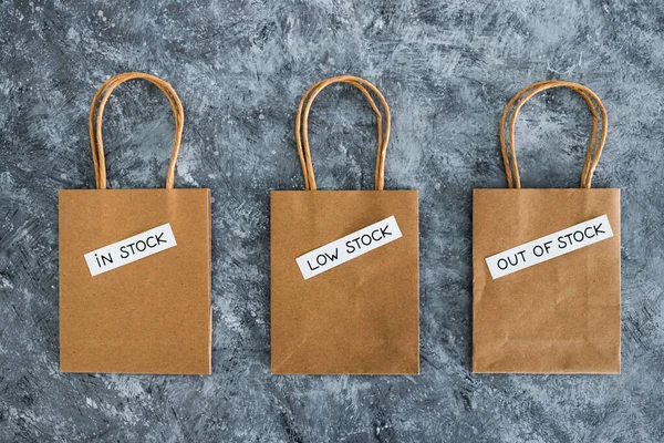 Stock Low Stock Out Stock Texts Top Shopping Bags Concept — Foto Stock