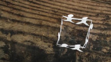 manpower and teamwork conceptual image, paper people chain creating a square