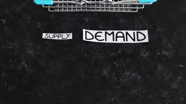Small Supply Text Big Demand Text Next Empty Shopping Basket — Vídeos de Stock