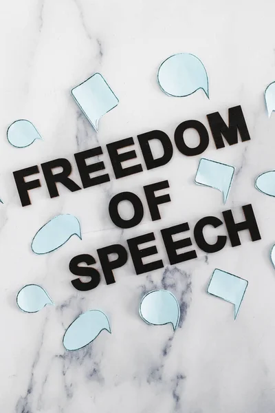 freedom of speech conceptual image, text surrounded by group of different comic bubbles representing diverse opinions and points of view