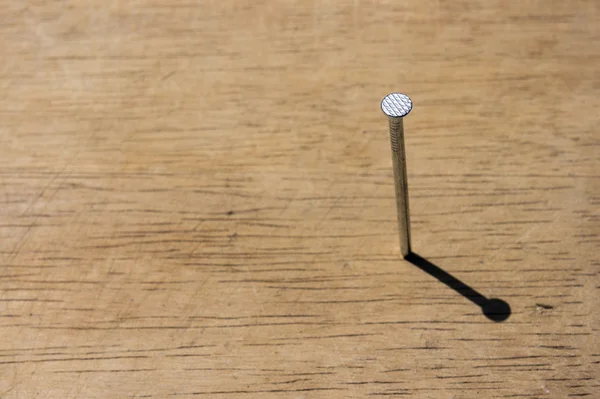 Spike Nails on old wood background. — Stock Photo, Image