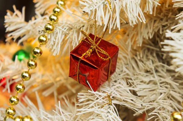 Christmas ornaments on a white tree — Stock Photo, Image