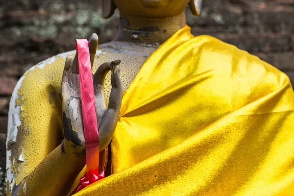 Garland wear on golden buddha hand — Stock Photo, Image