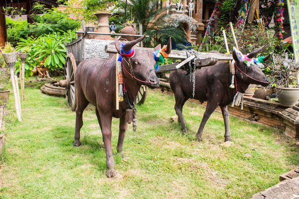 Sculpture of two bulls with cart