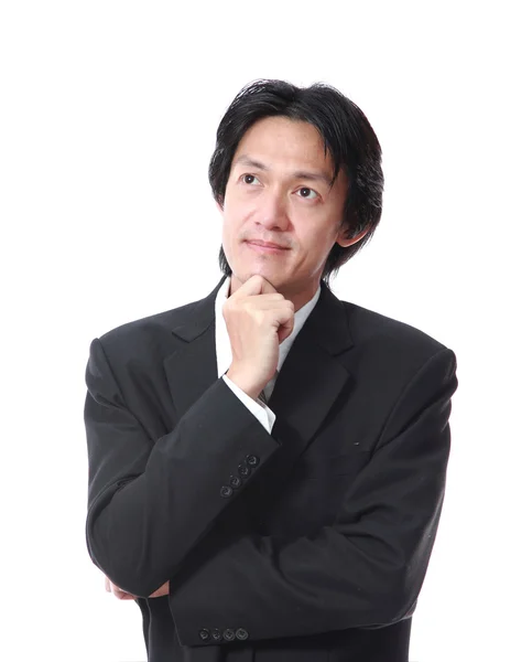 Asian young man thinking on white background — Stock Photo, Image