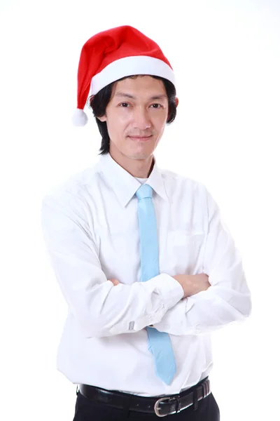 Giovane uomo con un cappello di Babbo Natale e sorridente . — Foto Stock