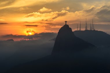 Sunset at christ redeemer, Rio de Janeiro, Brazil  clipart