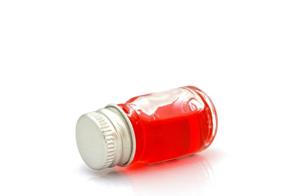 Flaska röd olja isolerad på vit — Stockfoto