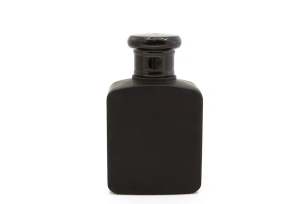 Frasco de perfume negro sobre fondo aislado — Foto de Stock