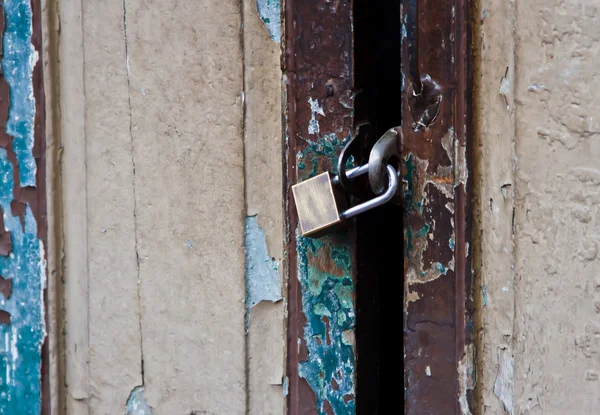 Old key lock on old wooden wall — Stock Photo, Image