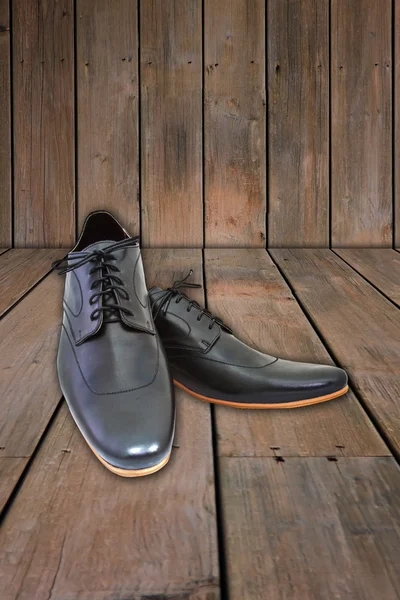 Black shoes on wood background. — Stock Photo, Image