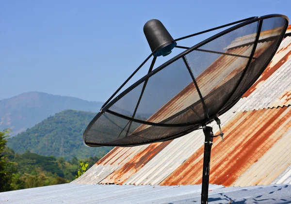 Satellite dish with sky on roof — Stock Photo, Image