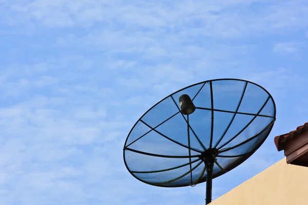 Satellite dish with sky on roof — Stock Photo, Image