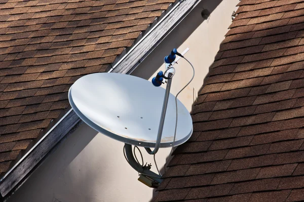 Satellite dish with sky on roof — Stock Photo, Image