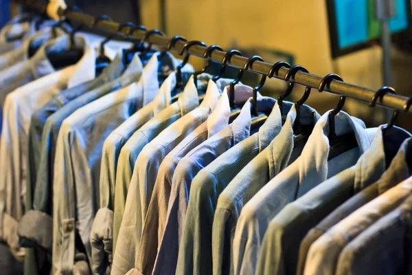 Colors of rainbow. Variety of casual shirts on hangers — Stock Photo, Image