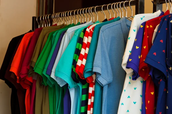 Colors of rainbow. Variety of casual shirts on hangers — Stock Photo, Image