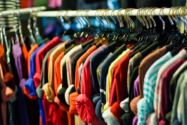 Colors of rainbow. Variety of casual shirts on hangers — Stock Photo, Image