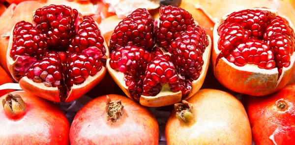 A fruit pomegranate on ice — Stock Photo, Image