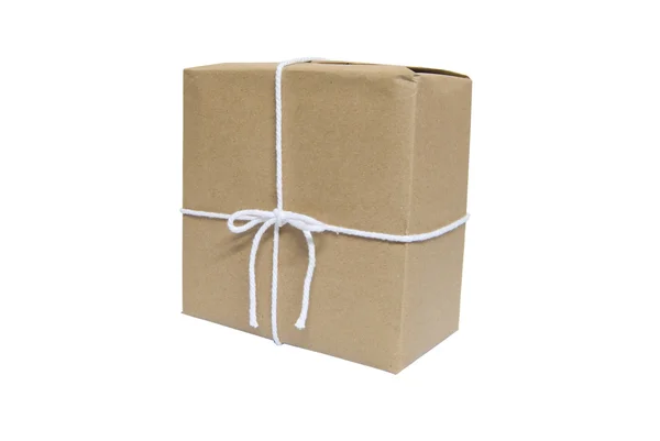 Gift package in brown paper wrapper tied with twine isolated on white background — Stock Photo, Image