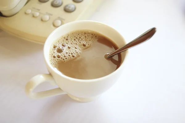 Taza de café en la mesa — Foto de Stock