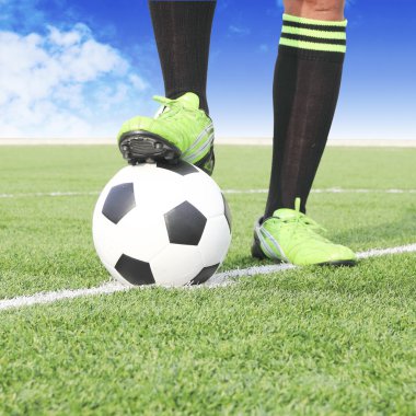 Soccer ball with foot of player kicking it