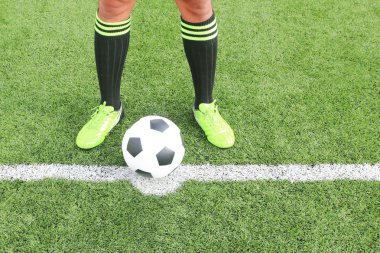 Soccer ball with foot of player kicking it