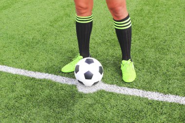 Soccer ball with foot of player kicking it