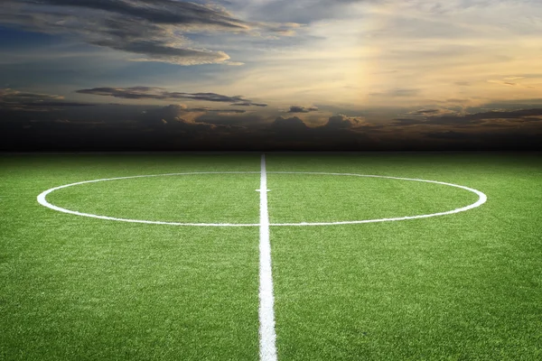 Campo de fútbol con puesta de sol — Foto de Stock