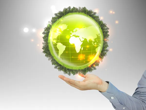 Holding a glowing earth globe in his hands — Stock Photo, Image