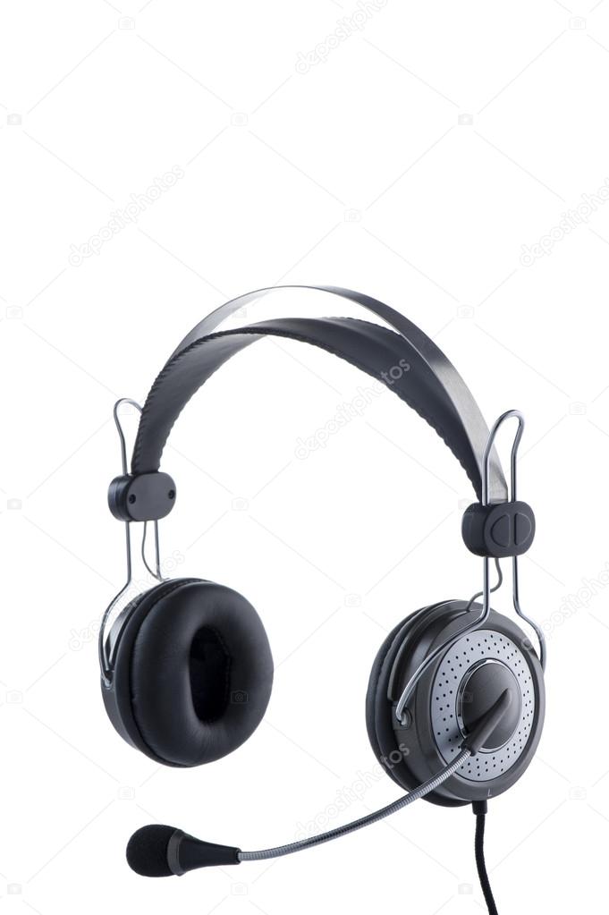 The modern mid-size headphones with a microphone and a wire. Isolated on white.