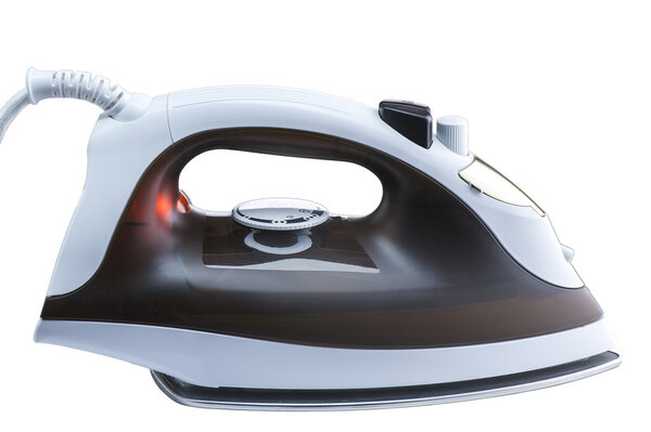 Modern electric iron, white and brown. With burning red light.