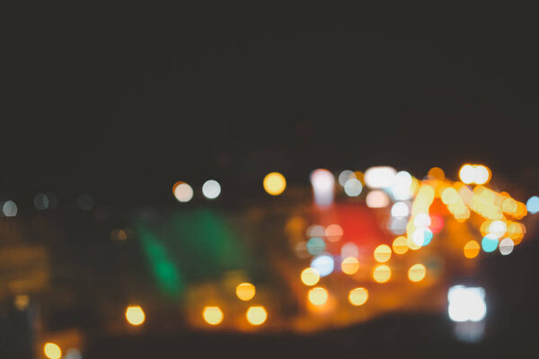 Colorful bokeh lights of night city as background. Abstract blur image of Road in night time
