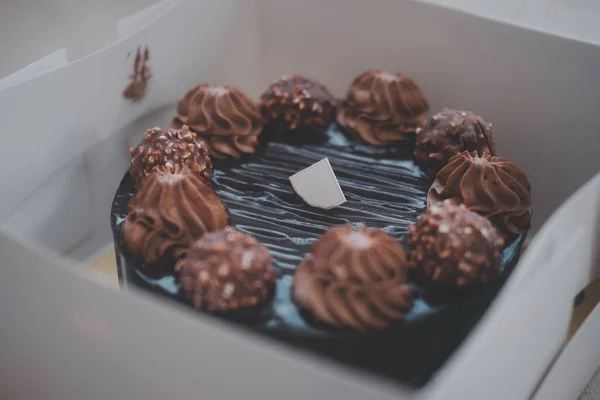 Delicious chocolate cake in box. Selective focus