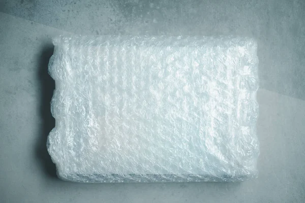 Caja Negra Envuelta Plástico Burbuja Envoltura Protección Para Transporte —  Fotos de Stock